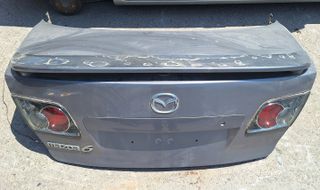Mazda 6 Πορτ μπαγκαζ με φαναρια/Πορτα οδηγου/Διακοπτες παραθύρων/Τιμονι/Κονσόλα με Χειριστήρια/Ποτηροθηκες/Κονσολα λεβιε ταχυτήτων/Φλασιερα με σερπατινα