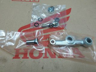 HONDA C90 CUB/ GLX 50/ C50C 12V/ C50Z2 6V ΑΡΙΣΤΕΡΟ ΜΠΡΑΤΣΟ/ ΝΥΧΙ ΕΜΠΡΟΣ ΑΜΟΡΤΙΣΕΡ ΓΝΗΣΙΟ