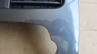 Πρόσοψη κονσόλας (Carbon fiber look) με κεντρικούς αεραγωγούς και alarm από Chevrolet Spark 2010-2015-thumb-2