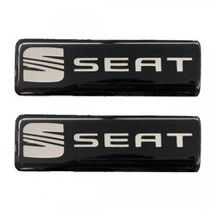 Seat 1992>2013 σήματα βιδωτά 10 χ 3 cm σε μαύρο/χρώμιο για πατάκια – 2 τεμ.