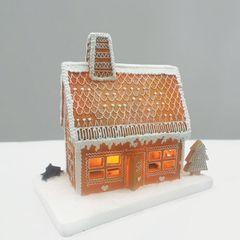 Διακοσμητικό LED GINGERBREAD σπίτι σε λευκό & καφέ χρώμα με θερμό χρώμα φωτός μπαταρίας & διάσταση 25x15x23cm