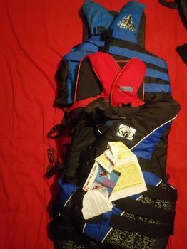 3 life vest and 2 wet suit 