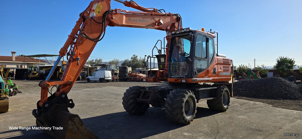 Εκσκαφέας Με Λάστιχα Doosan 2015 DX140W