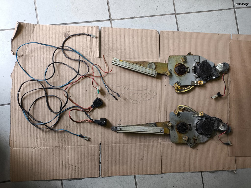 SUZUKI SWIFT 1996'-2005' 4/5ΘΥΡΟ ΓΡΥΛΟΙ ΜΠΡΟΣΤΙΝΟΙ ΗΛΕΚΤΡΙΚΟΙ ΣΕΤ ΜΕ ΠΛΕΞΟΥΔΑ ΚΑΙ ΔΙΑΚΟΠΤΕΣ.