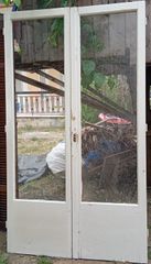 Ξύλινες μπαλκονόπορτες διπλές και παράθυρα με παντζούρια