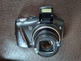 Canon PowerShot SX150 IS 14.1 MP Digital Camera with 12x Wide-Angle Optical Image Stabilized Zoom with 3.0-Inch LCD (Black)