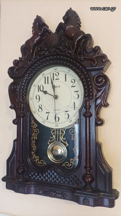 Ρολόϊ τοίχου καινούριο, με μουσική και εκκρεμές.