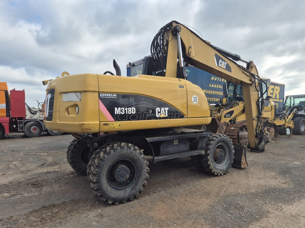 Εκσκαφέας Με Λάστιχα CAT 2010 M318 D