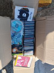 7 κούτες γεμάτες με διάφορα CDs & DVDs!