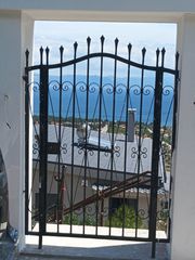 Κάγκελα μάντρας, γκαραζοπορτα και αυλοπορτα από μασίφ σίδερο