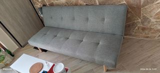 Sofabed, office chair and coffee table