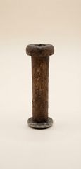 An hourglass within a wooden thread spool.-thumb-1