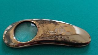 A magnifying glass-bookmark-paperweight