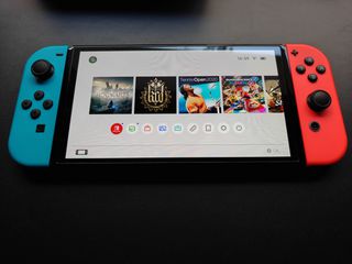 Nintendo Switch OLED 64GB +Hogwarts Legacy-thumb-1