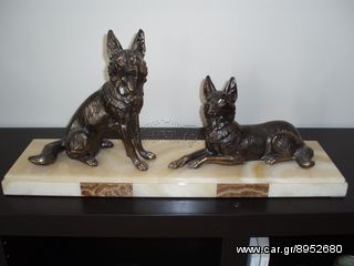 2 bronze dogs on marble 